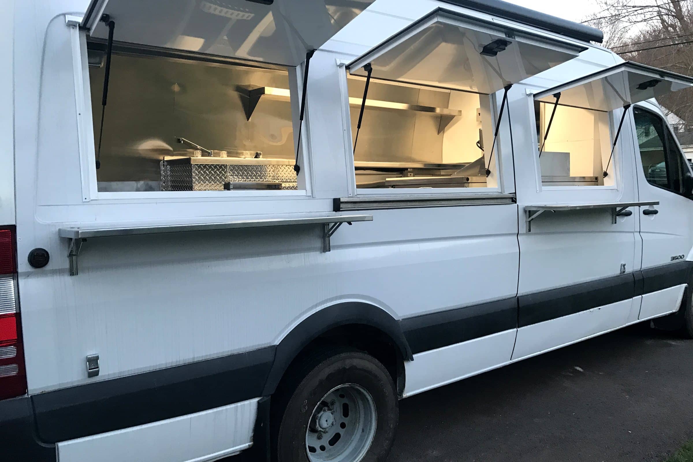 Ay! Arepa truck with custom serving windows and fold-down shelves