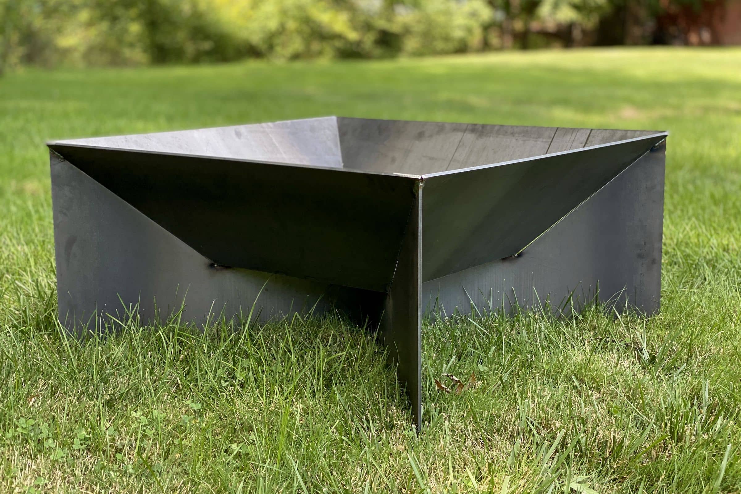 Square hot-rolled steel fire pit on a lawn