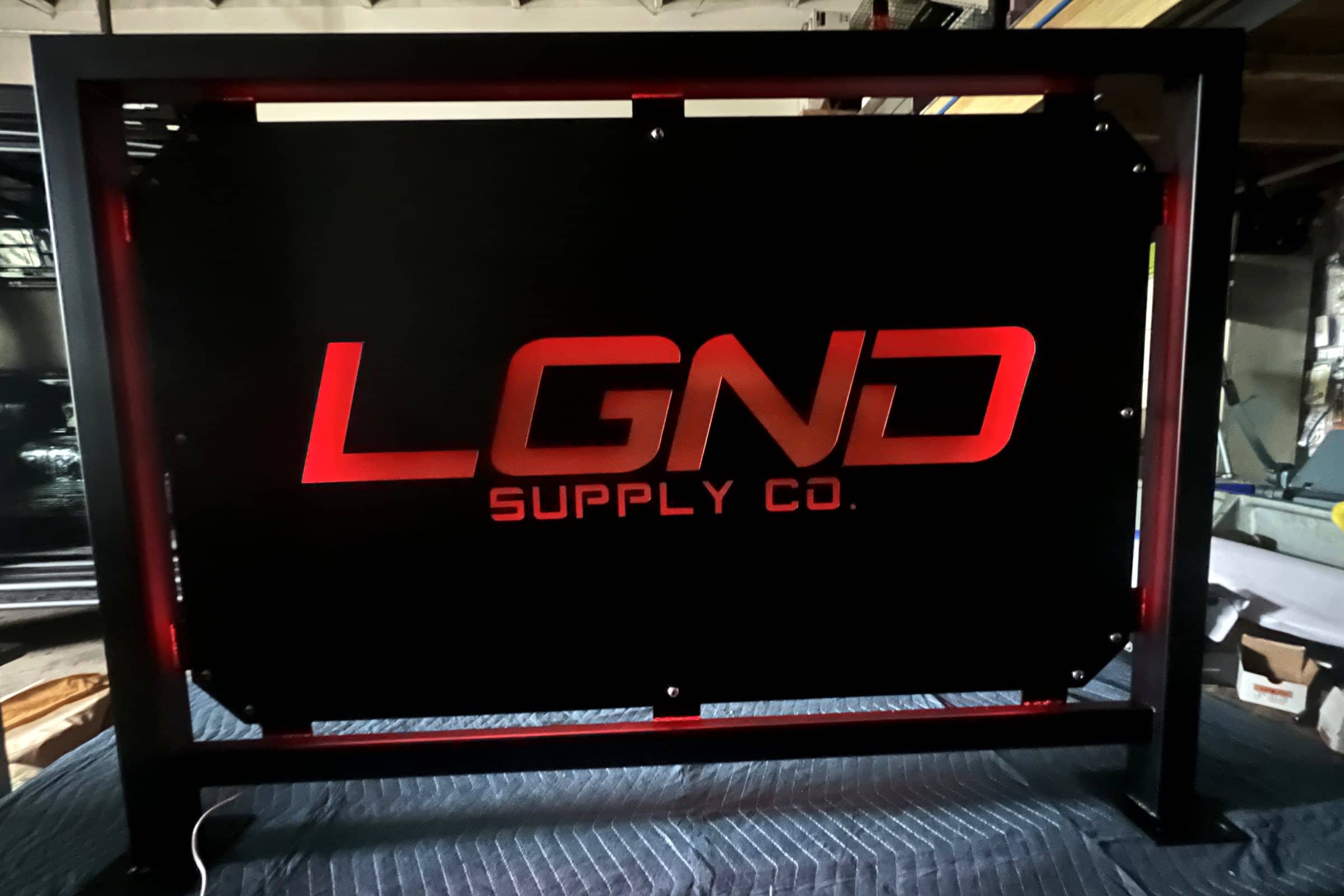 LED-backlit LGND Supply sign with red lighting