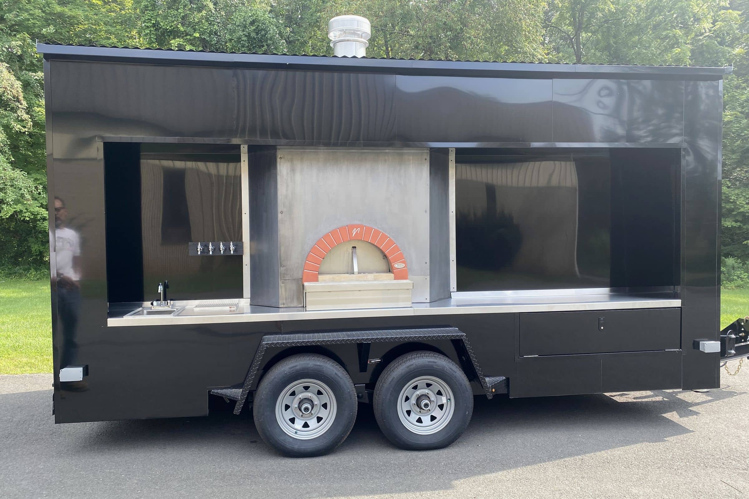 Side profile of the V's Rolling Stone pizza trailer with Valoriani oven